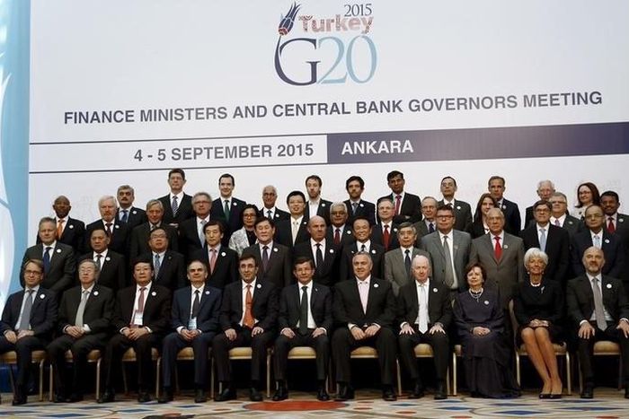 Turkey's Prime Minister Ahmet Davutoglu (6th L), finance ministers and central bank governors gather for a group photo of the G20 Finance Ministers and Central Bank Governors in Ankara, Turkey, September 5, 2015. Finance ministers and central bank gove...