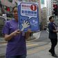 Edward Lau (R), 29, a businessman who participated in Occupy Central protests in 2014 and is running for the upcoming district elections, campaigns with a supporter in Hong Kong, China November 11, 2015.