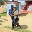 Policemen detain a protester during clashes in Lubumbashi, Democratic Republic of Congo November 10, 2015. REUTERS/Kenny Katombe