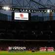 Arsenal and Tottenham players holding a one-minute silence for Remembrance Day in England
