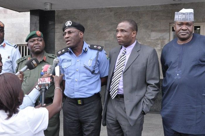 Lagos State Commissioner of Police, Mr. Fatai Owoseni (middle) addressing the media
