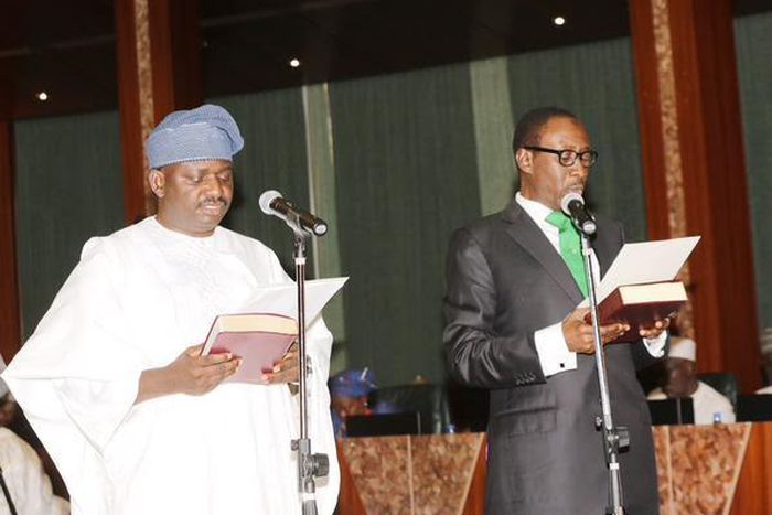 Femi Adesina (left) being sworn in as the President’s Special Adviser on Media and Publicity.