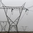 Electricity pylons and power transmission lines are seen at western desert road near Minya governorate, south of Cairo, on a hot and hazy day with temperatures reaching 48 degrees Celsius (116 Fahrenheit) May 27, 2015. REUTERS/Amr Abdallah Dalsh