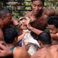 Men tear live goats apart during Nepalese festival