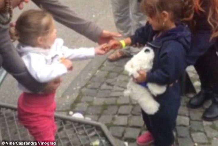 The adorable and heartwarming picture of a little German girl sharing her weekend sweets with a newly arrived refugee has gone viral.