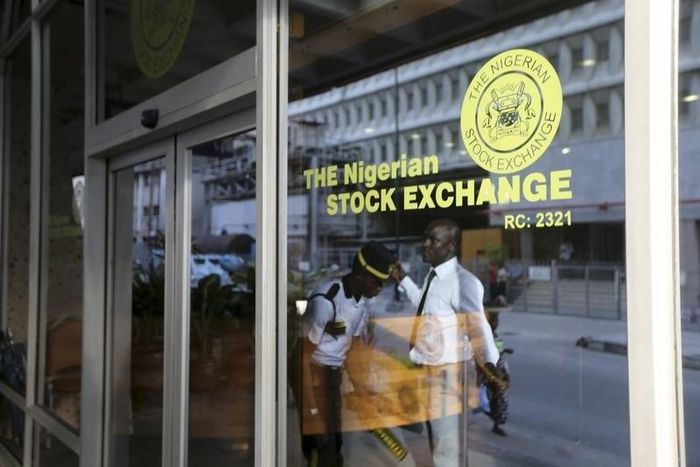 A security officer checks a man outside the Nigerian Stock Exchange in Lagos April 8, 2014.    REUTERS/Akintunde Akinleye