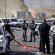 Israeli paramilitary police officers stand guard at the scene of what police said was an attempted ramming attack near the West Bank Jewish settlement of Kfar Adumim November 22, 2015.