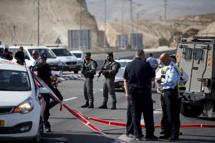 Israeli paramilitary police officers stand guard at the scene of what police said was an attempted ramming attack near the West Bank Jewish settlement of Kfar Adumim November 22, 2015.