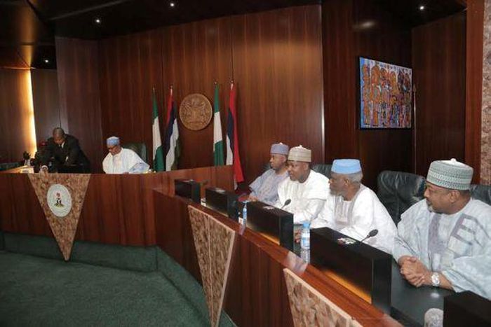 President Muhammadu Buhari swears in new INEC officials in Abuja on November 9, 2015