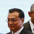 U.S. President Barack Obama walks behind China"s Premier Li Keqiang as they attend a family photo at the 27th Association of Southeast Asian Nations (ASEAN) Summit in Kuala Lumpur, Malaysia, November 22, 2015.