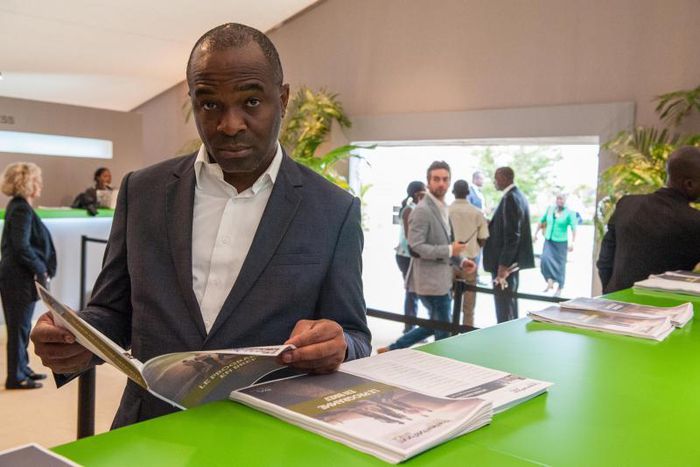 Participant of the NYFA 2015 going through the summit's brochure