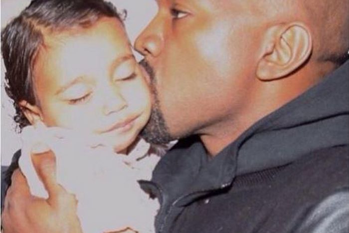 Kanye West kisses daughter North West