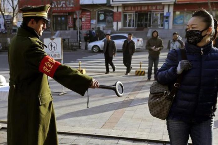 China security chief calls for greater "de-radicalisation" efforts