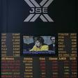 An electronic board displaying movements in major indices is seen at Johannesburg stock exchange in Sandton September 23, 2008. REUTERS/Siphiwe Sibeko