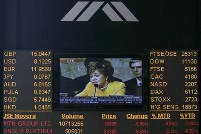 An electronic board displaying movements in major indices is seen at Johannesburg stock exchange in Sandton September 23, 2008. REUTERS/Siphiwe Sibeko