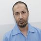 Saadi Gaddafi, son of Muammar Gaddafi, is seen inside Al-Hadba prison in Tripoli August 10, 2015. REUTERS/Ismail Zitouny