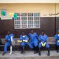 Ebola health workers rest outside a quarantine zone at a Red Cross facility in the town of Koidu, Kono district in Eastern Sierra Leone December 19, 2014.  
REUTERS/Baz Ratner
