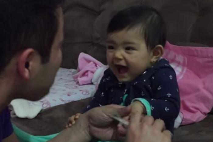 Cute baby tries to prank dad when he tries to cut her nails