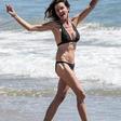 Janice Dickinson rocking a black halter neck bikini, while frolicking at a Malibu Beach