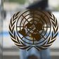 A security guard walks past the United Nations logo at the U.N. Headquarters in New York, August 31, 2013. REUTERS/Carlo Allegri