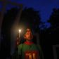 A Bangladeshi activist holds a candle, as they protest against the killing of secular blogger Niloy Chakrabarti in Dhaka, Bangladesh.
