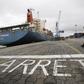 A man walks at a container port in Abidjan October 4, 2012. REUTERS/Thierry Gouegnon
