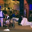  Victims lay on the pavement outside a Paris restaurant, Friday, Nov. 13, 2015. Police officials in France on Friday report multiple terror incidents, leaving many dead. It was unclear at this stage if the events are linked.