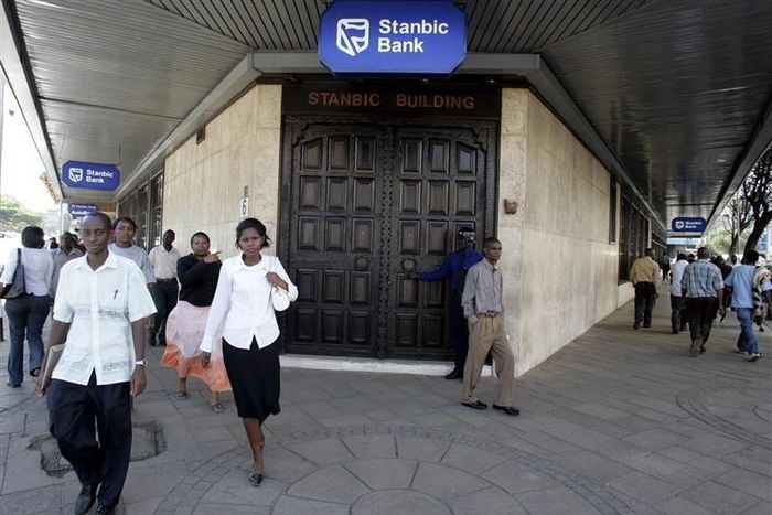 Kenyan city residents walk past Stanbic Bank in the capital Nairobi  in a file photo.  REUTERS/Antony Njuguna