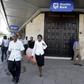 Kenyan city residents walk past Stanbic Bank in the capital Nairobi  in a file photo.  REUTERS/Antony Njuguna