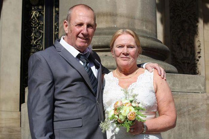 Christine and Taffy Sharlotte moments after being married, on the steps of Leeds Town Hall