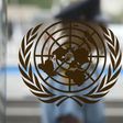 A security guard walks past the United Nations logo at the U.N. Headquarters in New York, August 31, 2013.    REUTERS/Carlo Allegri