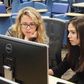 Emily Reid with a student at Girls Who Code