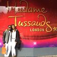 Julius Agwu and his wife at Madam Tussauds in London
