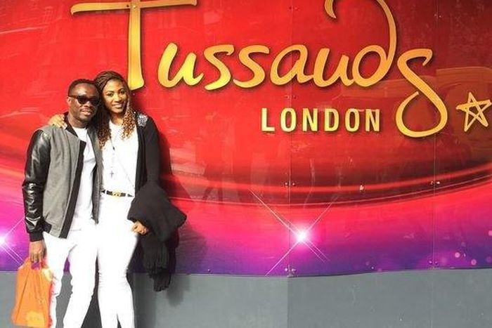 Julius Agwu and his wife at Madam Tussauds in London