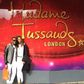 Julius Agwu and his wife at Madam Tussauds in London