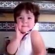 Crying baby girl immediately strikes a pose as soon as she sees a camera