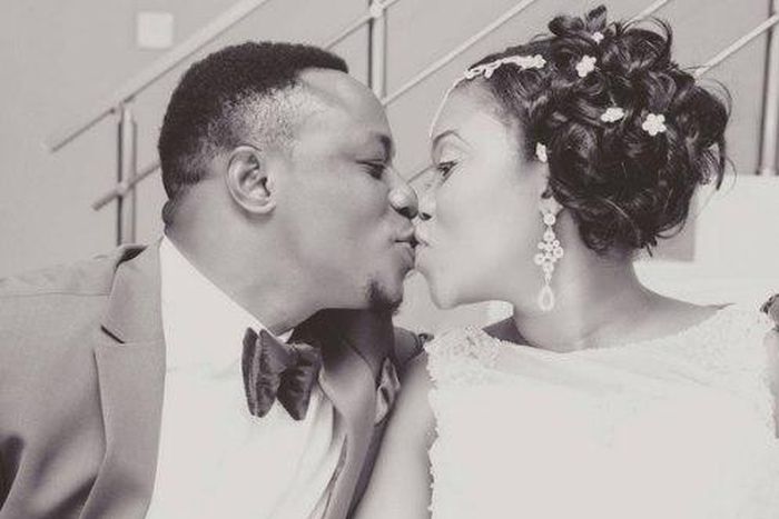 Chuddy K kissing his wife