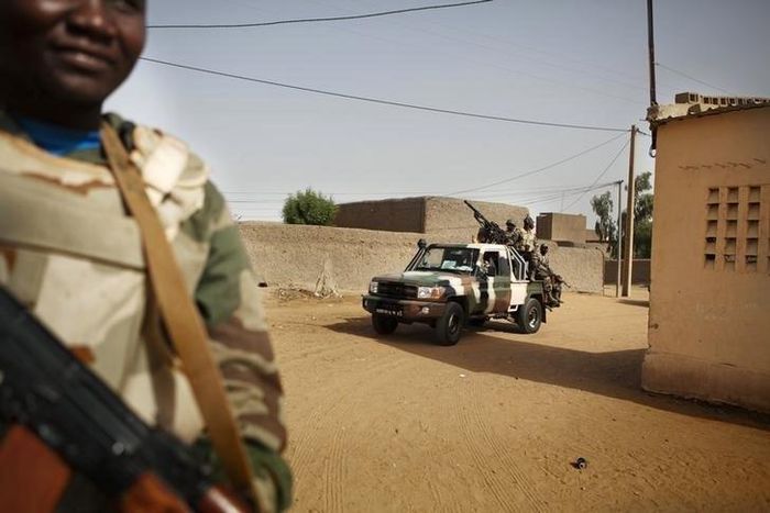 Soldiers from the Waraba Battalion, an EU-trained Malian army battalion, ride in military vehicles in Gao July 8, 2013. Picture taken July 8, 2013. REUTERS/Malin Palm
