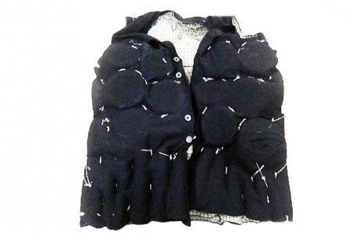 Tailored vest stuffed full of ivory products