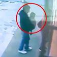 Armed robbers use a baby as cover to steal money and clothing in a store