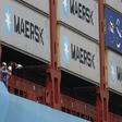 Crew members look out from the world's largest container ship, the MV Maersk Mc-Kinney Moller, as it berths during its maiden port of call at a PSA International port terminal in Singapore September 27, 2013. REUTERS/Edgar Su