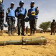 Peace keepers from the United Nations Hybrid Operation in Darfur (UNAMID) look at an RPG-7 projectile that was found at the Al-Abassi camp for internally displaced persons, after an attack by rebels, in Mellit town, North Darfur March 25, 2014. REUTERS...
