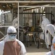 Health workers push a wheeled stretcher holding a newly admitted Ebola patient, 16-year-old Amadou, in to the Save the Children Kerry town Ebola treatment centre outside Freetown, Sierra Leone, December 22, 2014.  
REUTERS/Baz Ratner