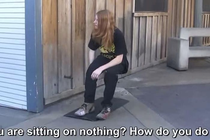 In this video, a man pretends to levitate in the air (sitting on an invisible chair).