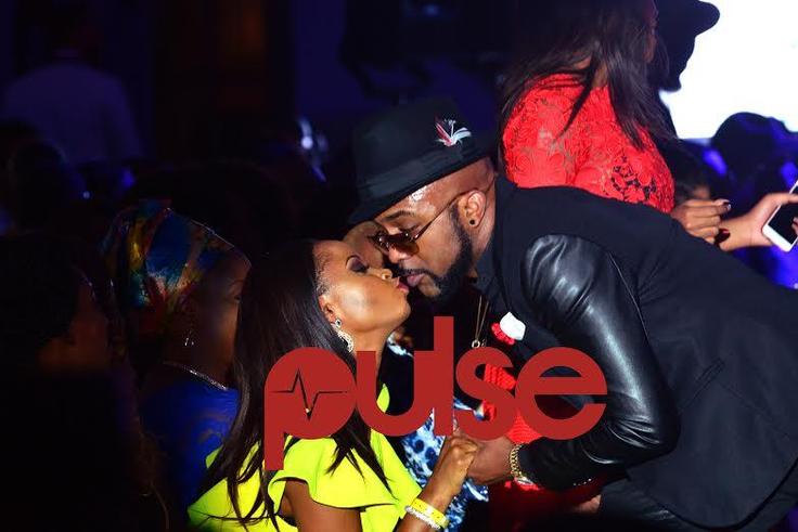 Banky W and Omowunmi Akinnifesi kissing at Elite Model Look
