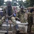 Seleka fighters take a break as they sit on a pick-up truck in the town of Goya June 11, 2014. REUTERS/Goran Tomasevic