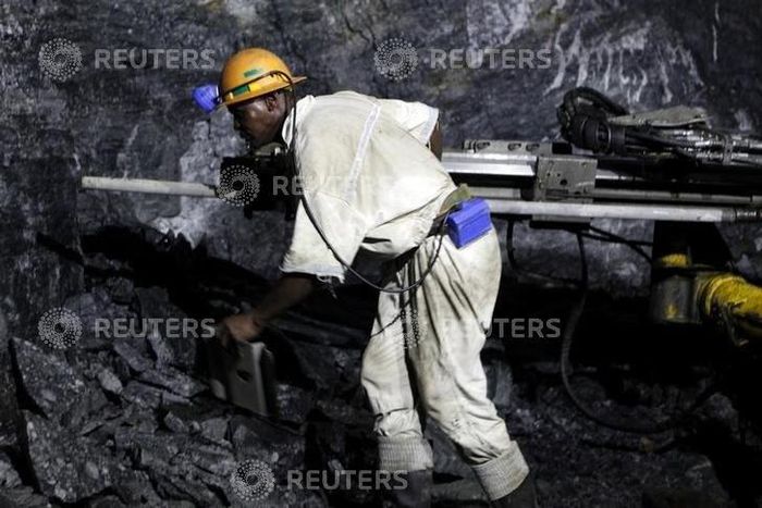 A mine worker is seen underground in South Deep mine outside Johannesburg June 4,2010. REUTERS/Siphiwe Sibeko