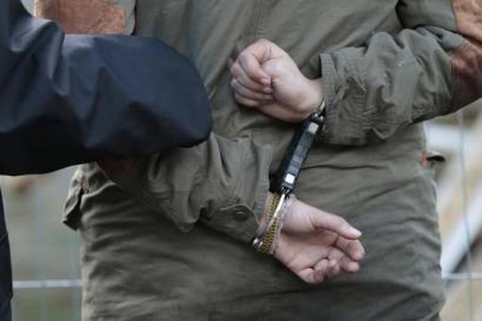 A police officer makes an arrest in a file photo.