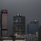 The logos of South Africa's three biggest banks, ABSA, Standard Bank and First National Bank (L-R), adorn buildings as winter storms hit Cape Town, July 8, 2015.  REUTERS/Mike Hutchings