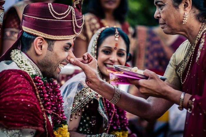 A funny moment at a Gujarati wedding. The mother in law says "watch out and be respectful." Gujarati weddings have a ceremony called Ponkvu or Ponkhana where the groom is welcomed by his mother-in-law, who first performs an aarti and then playfully pul...